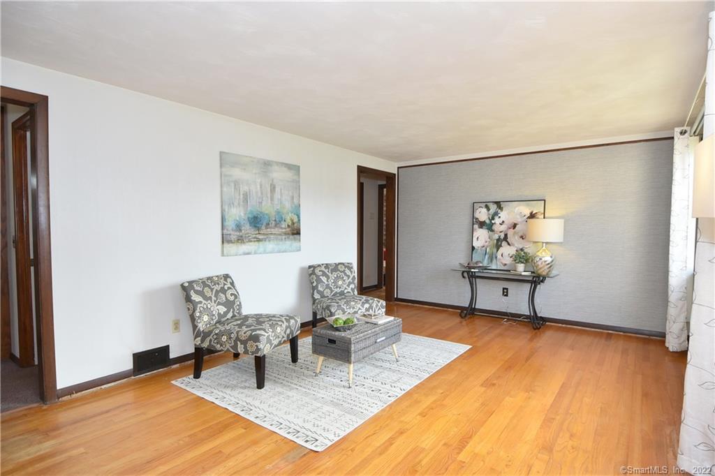 35 Bunce Road Wethersfield, CT 06109 - Photo 1 of 1 a living room with furniture and wooden floor