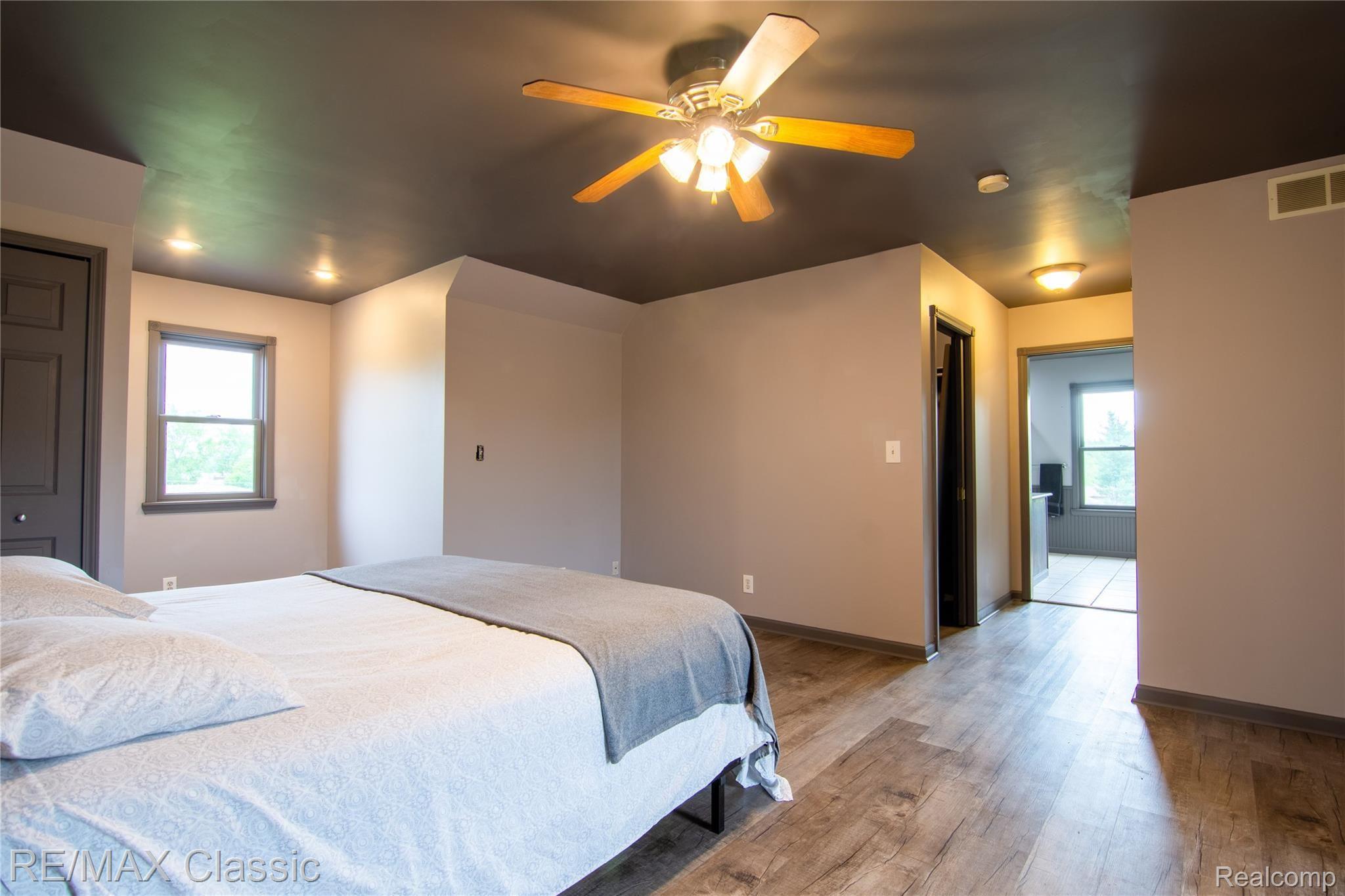 5765 Stanley Road Columbiaville, MI 48421 - Photo 15 of 40 Master bedroom with his and her walk in closets