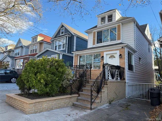 a view of a brick house with many windows