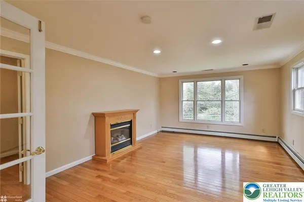 a view of an empty room with a window
