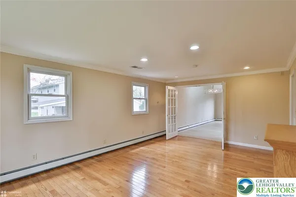 a view of an empty room with a window