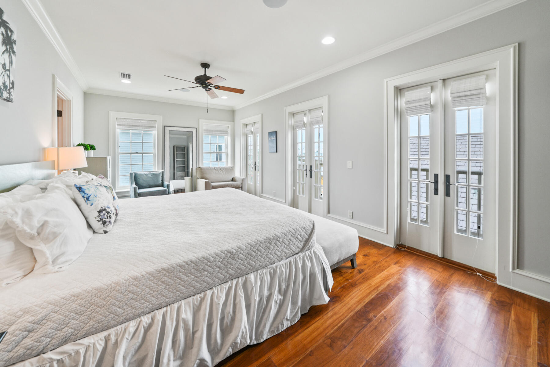 29 Pleasant Street, Unit 1 Inlet Beach, FL 32461 - Photo 33 of 66 a spacious bedroom with a large bed and a chandelier
