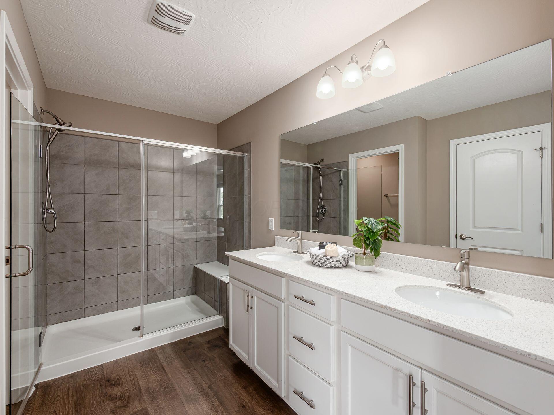 404 Colony Ridge Drive Delaware, OH 43015 - Photo 26 of 47 Owners Suite double vanity, 6 foot shower and separate toilet room