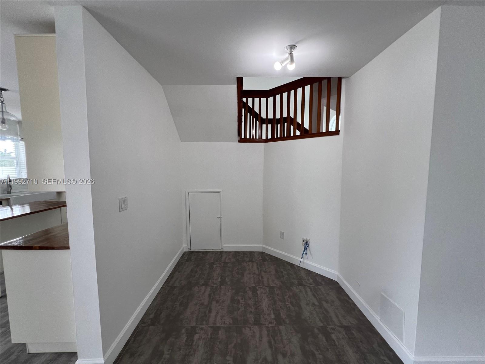 15511 Southwest 59th Street Miami, FL 33193 - Photo 15 of 34 a view of a hallway with wooden floor