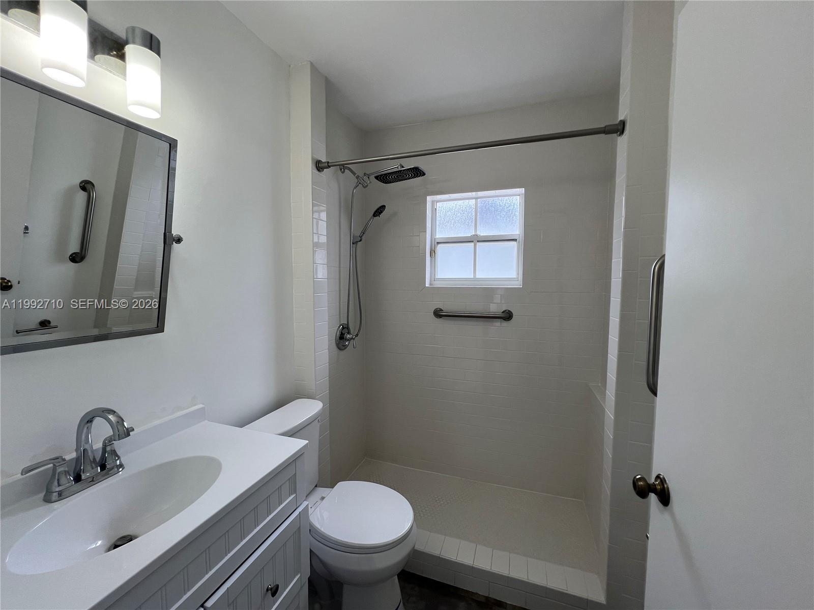 15511 Southwest 59th Street Miami, FL 33193 - Photo 16 of 34 a bathroom with a sink toilet and shower