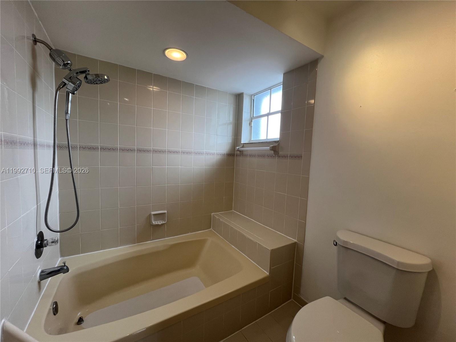 15511 Southwest 59th Street Miami, FL 33193 - Photo 28 of 34 a bathroom with a toilet and a shower