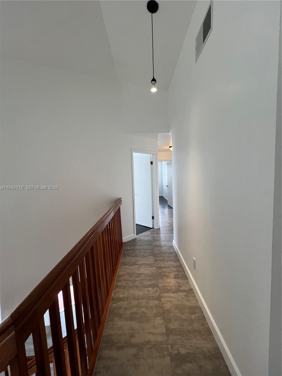 15511 Southwest 59th Street Miami, FL 33193 - Photo 30 of 34 a view of a hallway with wooden floor