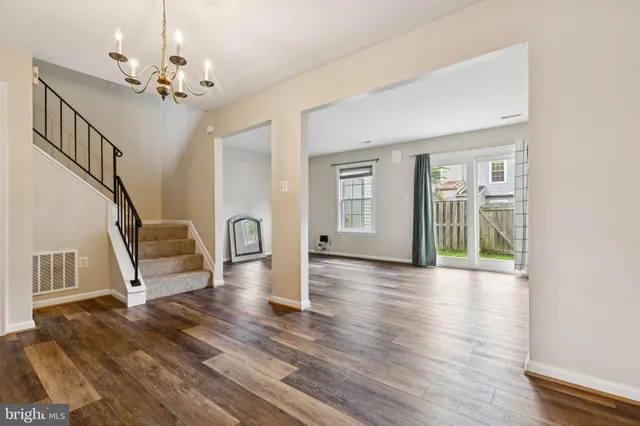 a view of an entryway with wooden floor