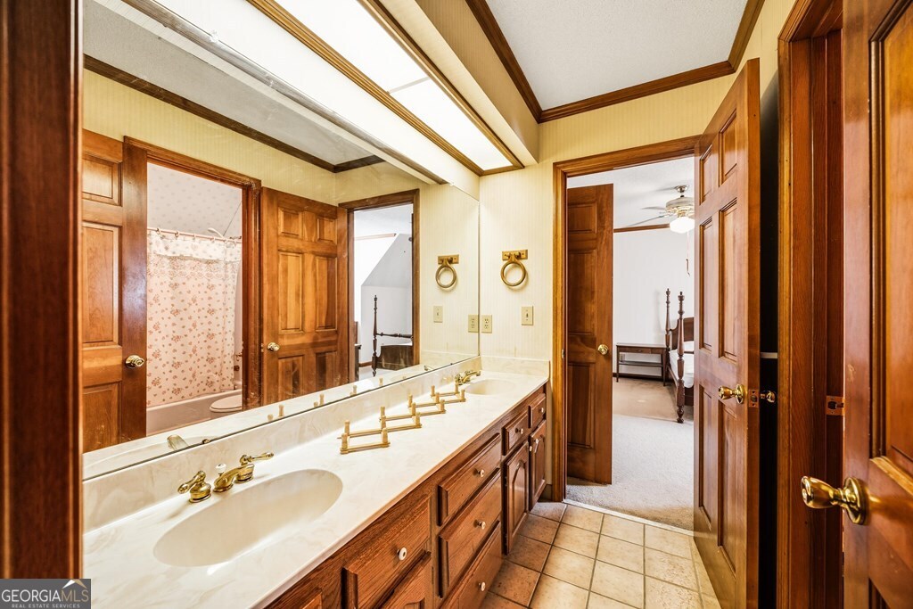 206 Ridge Circle Dublin, GA 31021 - Photo 15 of 23 a spacious bathroom with a double vanity sink a mirror and a shower