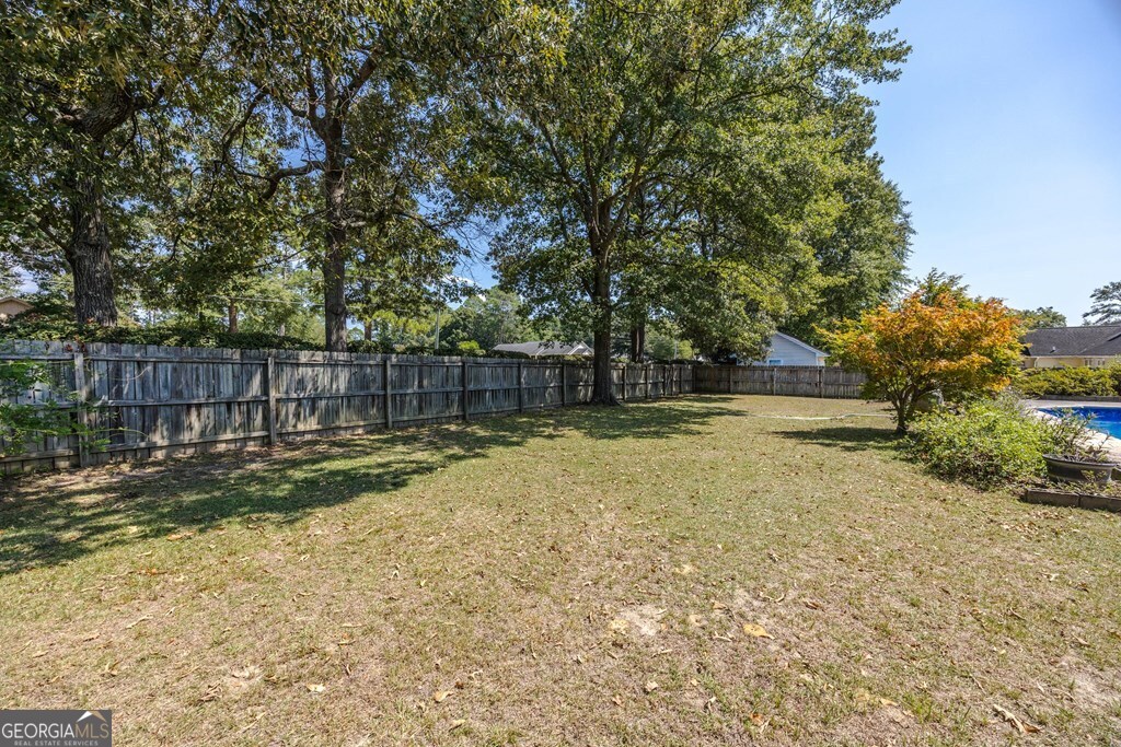 206 Ridge Circle Dublin, GA 31021 - Photo 22 of 23 a view of backyard with tree