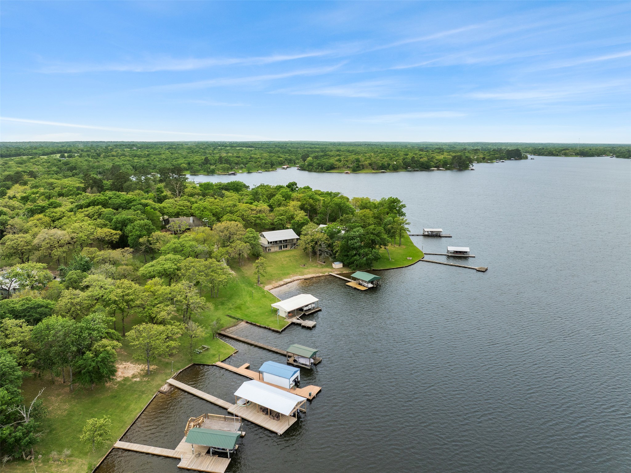 10959 Clyde Acord Road Franklin, TX 77856 - Photo 36 of 39 an aerial view of a house with a lake view