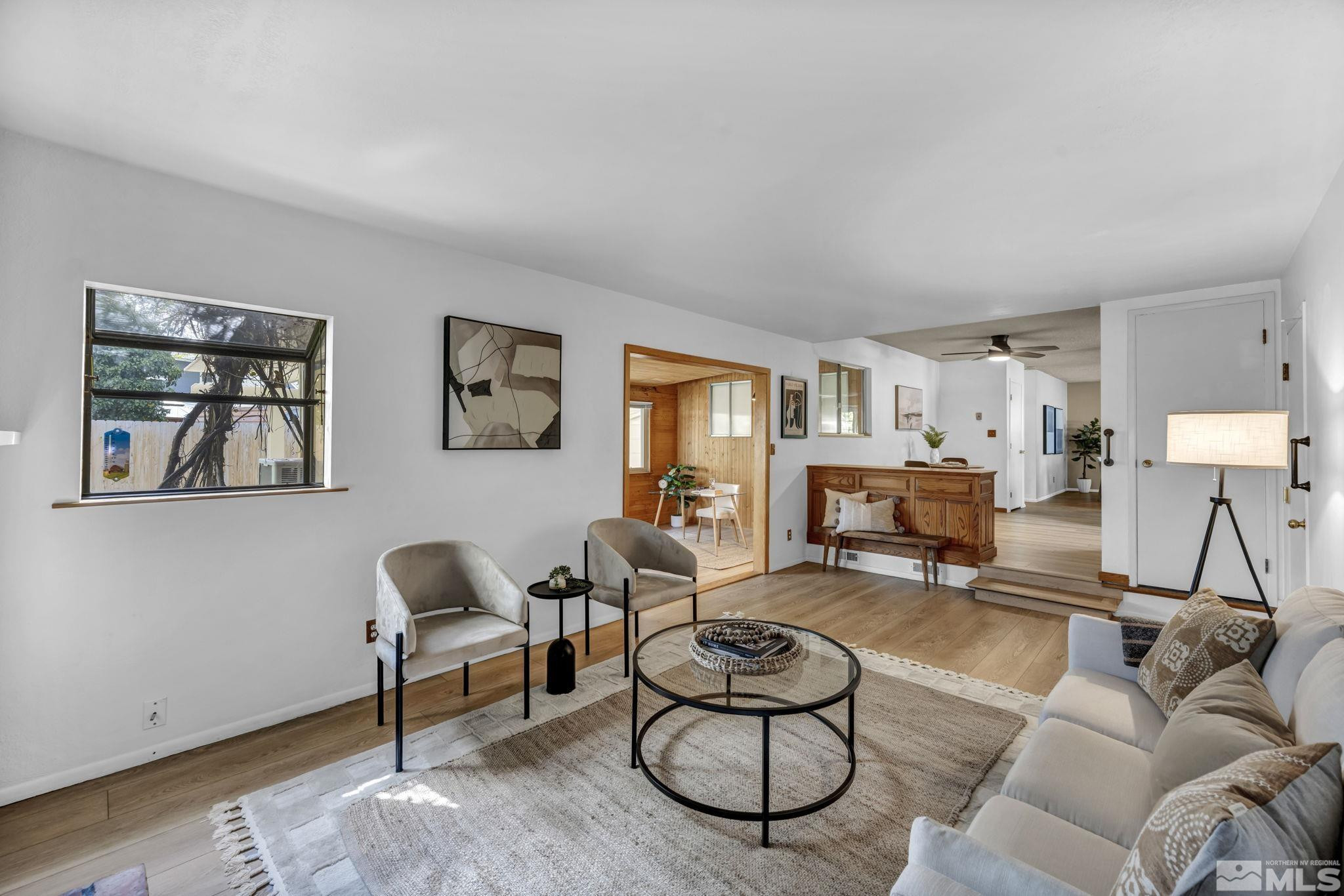 909 Norrie Drive Carson City, NV 89703 - Photo 15 of 39 a living room with furniture and a wooden floor