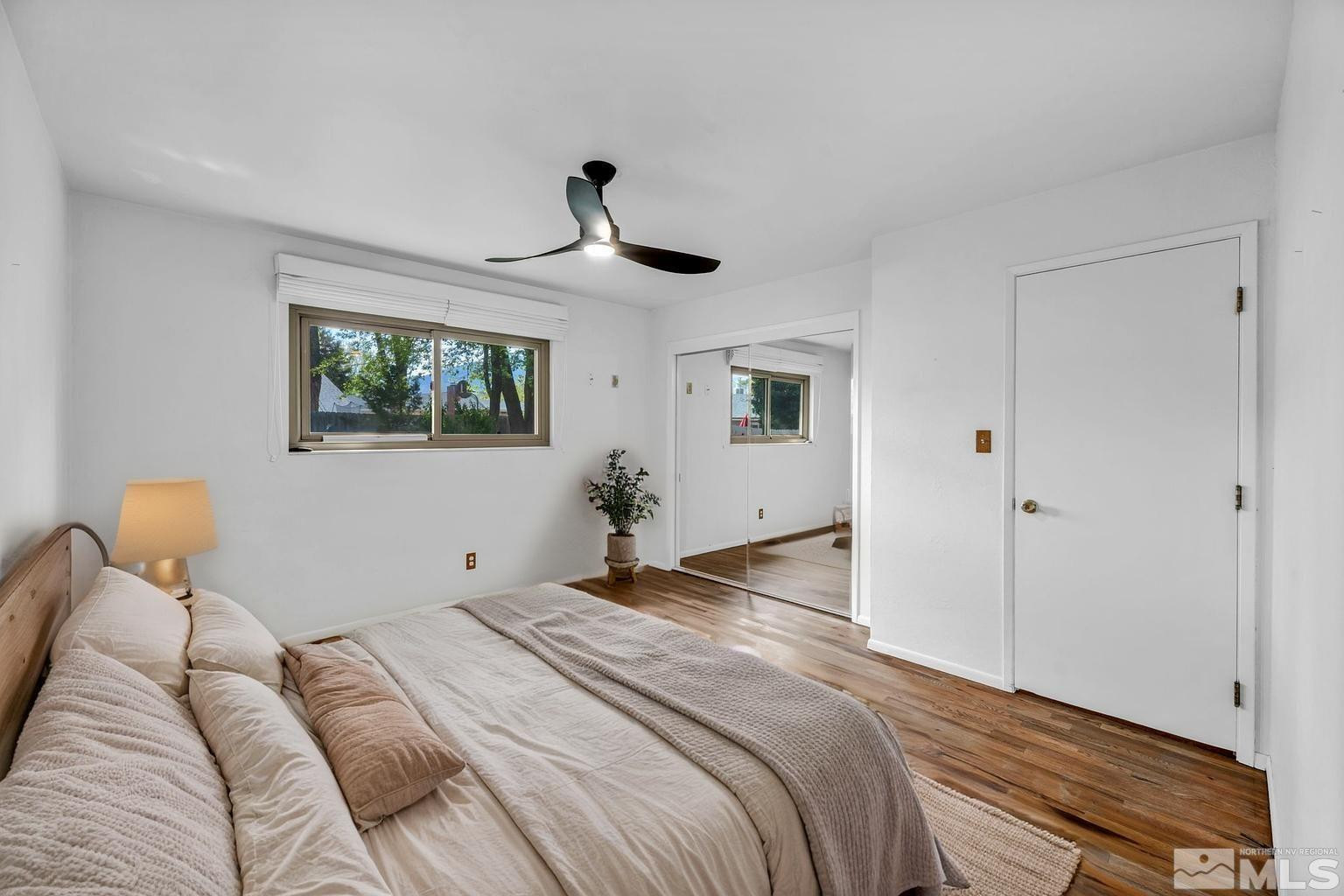 909 Norrie Drive Carson City, NV 89703 - Photo 20 of 39 a bedroom with a large bed and a window