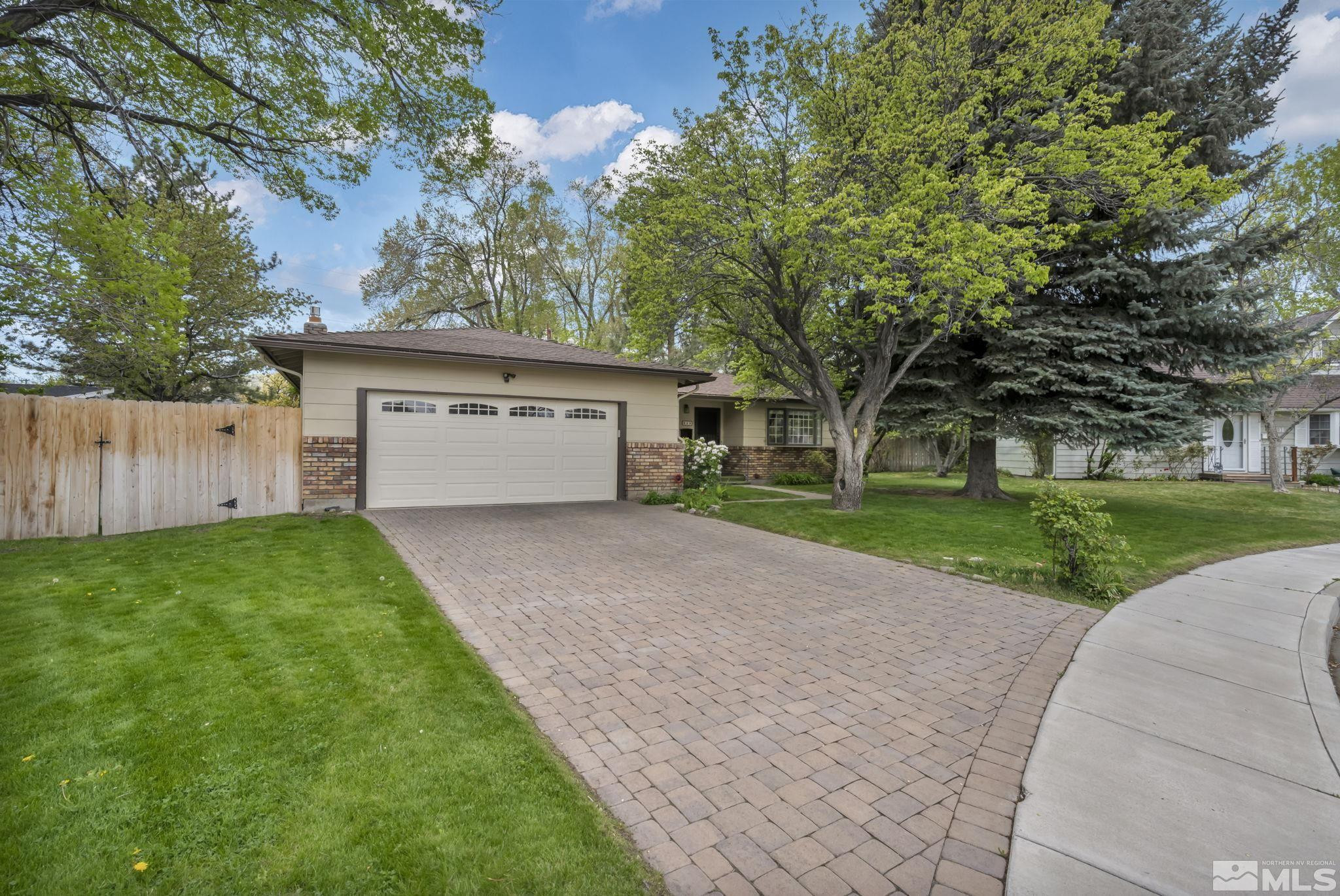 909 Norrie Drive Carson City, NV 89703 - Photo 2 of 39 a view of a house with a yard and tree
