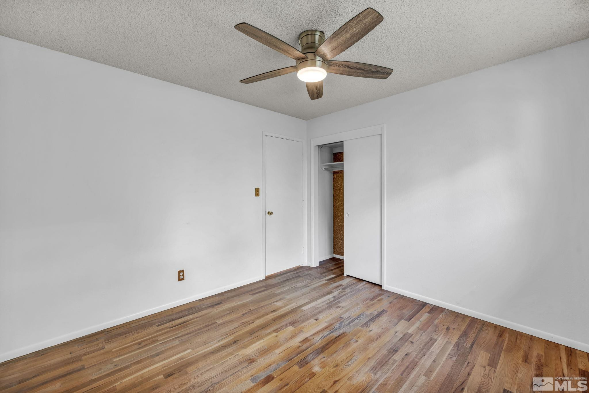 909 Norrie Drive Carson City, NV 89703 - Photo 23 of 39 wooden floor in an empty room