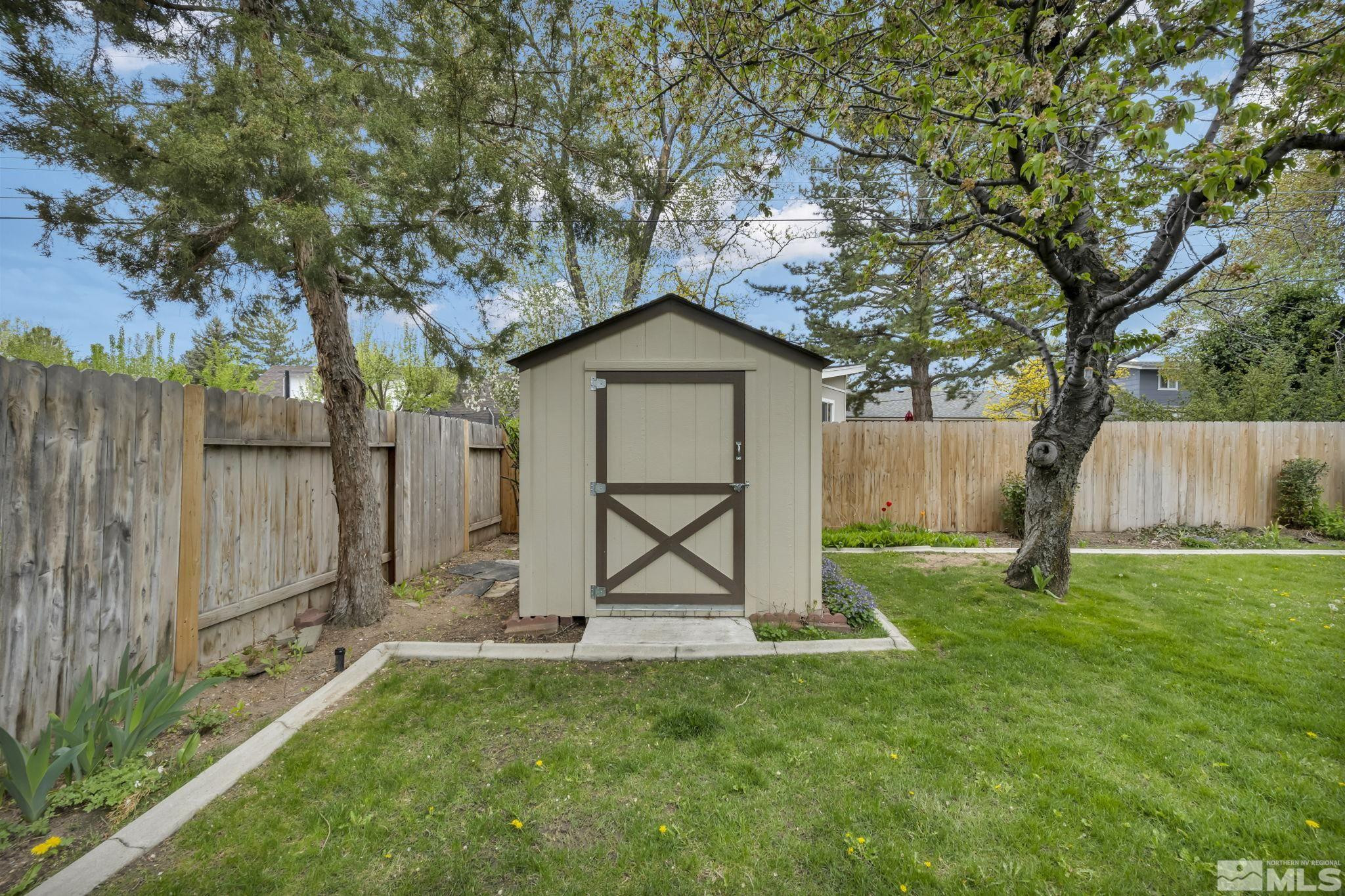 909 Norrie Drive Carson City, NV 89703 - Photo 27 of 39 a front view of a house with garden