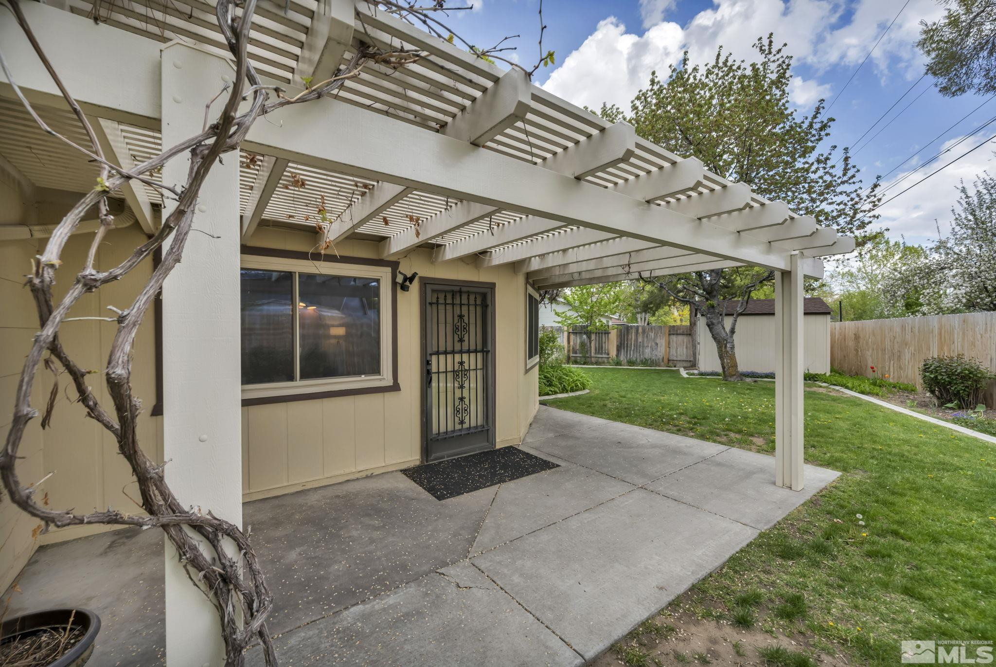 909 Norrie Drive Carson City, NV 89703 - Photo 37 of 39 a view of a house with backyard and porch