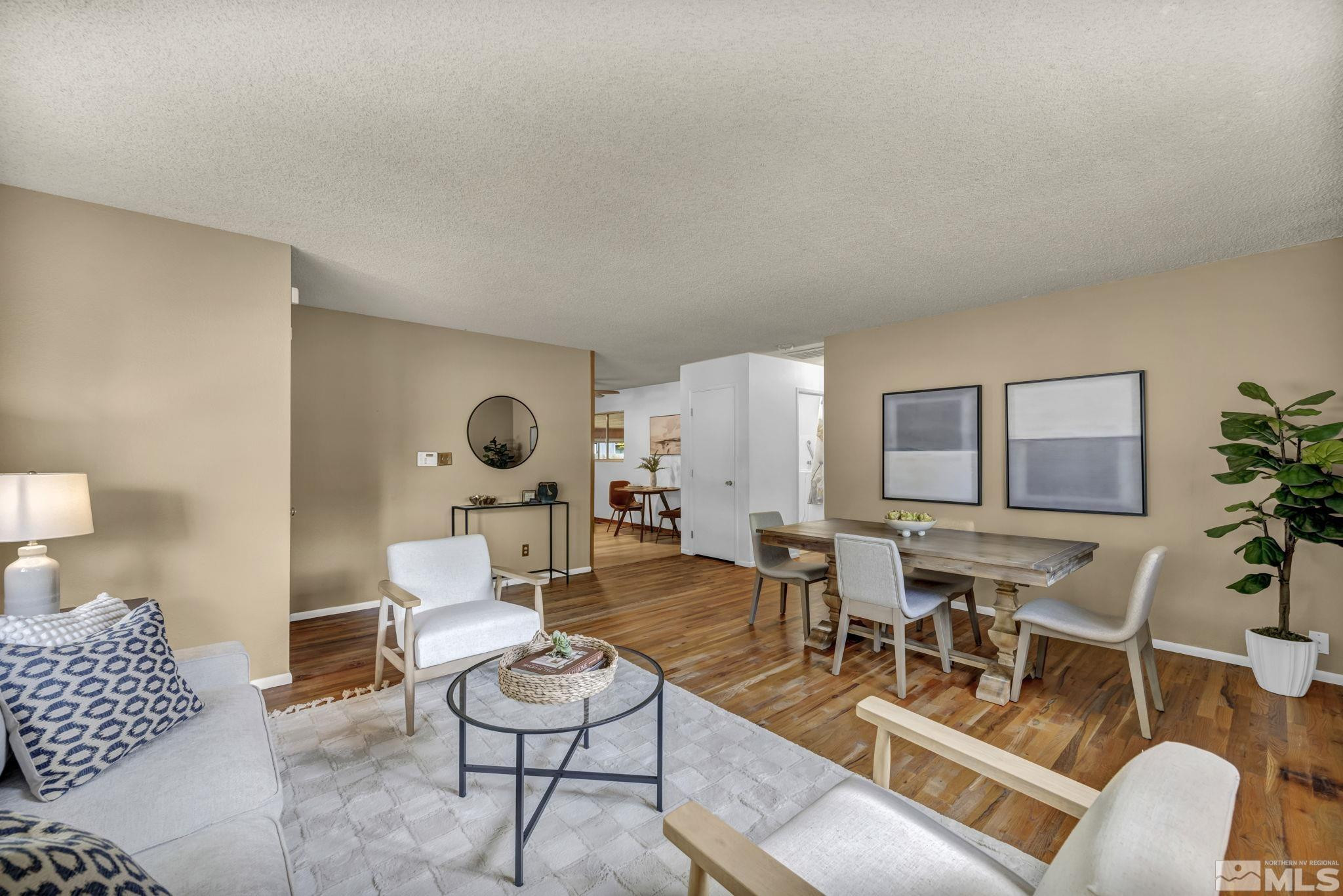 909 Norrie Drive Carson City, NV 89703 - Photo 5 of 39 a living room with furniture and a table