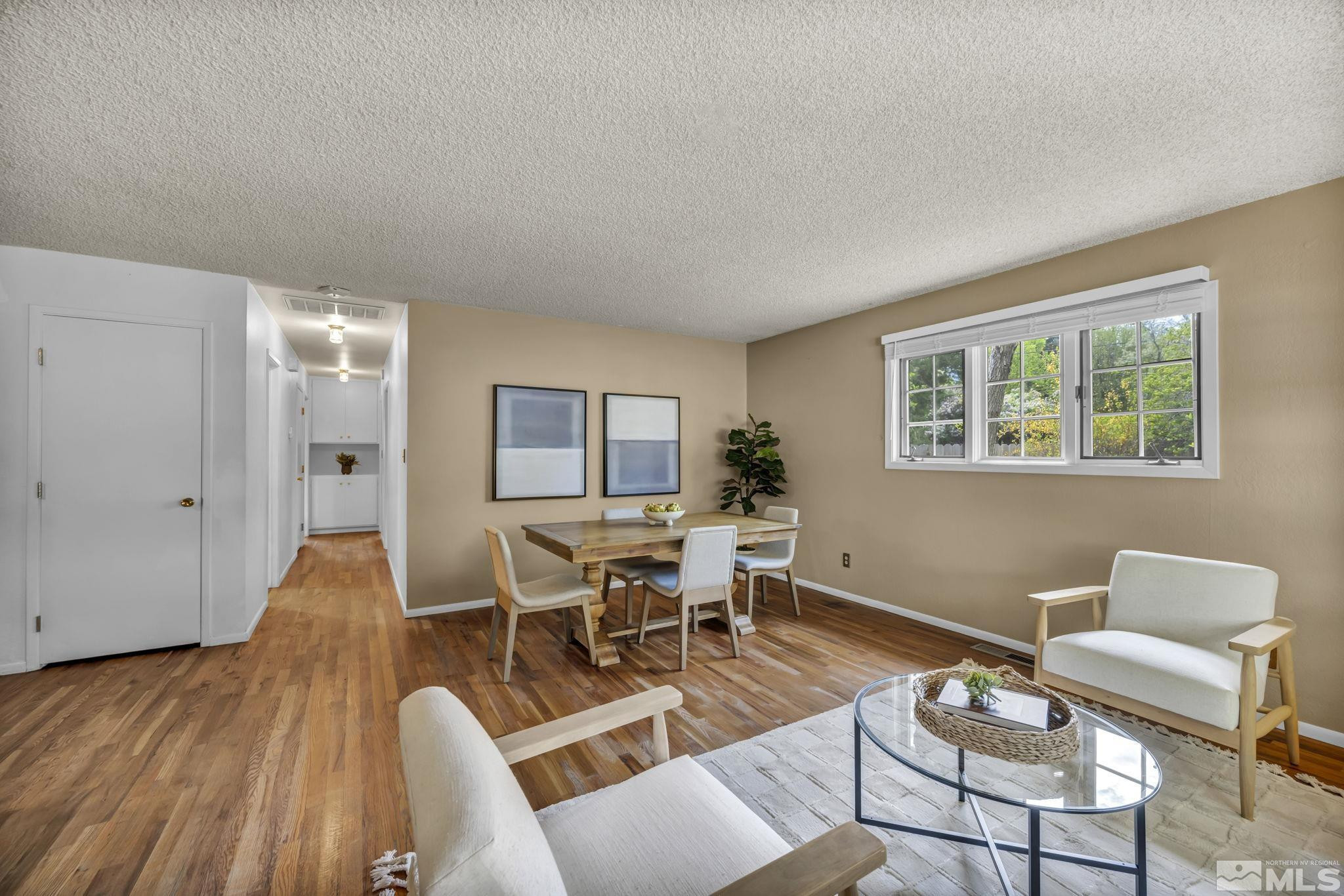 909 Norrie Drive Carson City, NV 89703 - Photo 6 of 39 a living room with furniture dining table and a window
