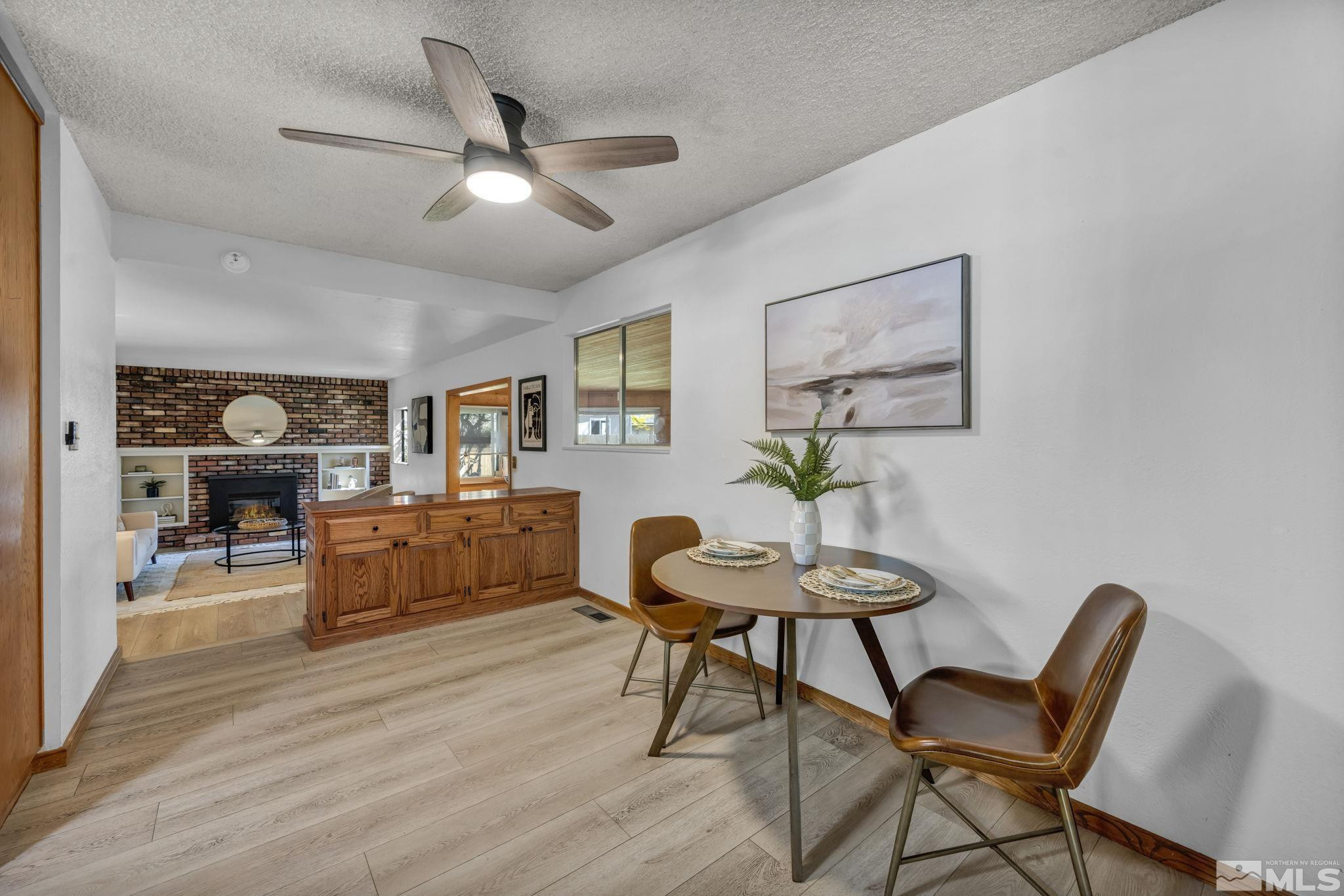 909 Norrie Drive Carson City, NV 89703 - Photo 9 of 39 a living room with furniture and a wooden floor