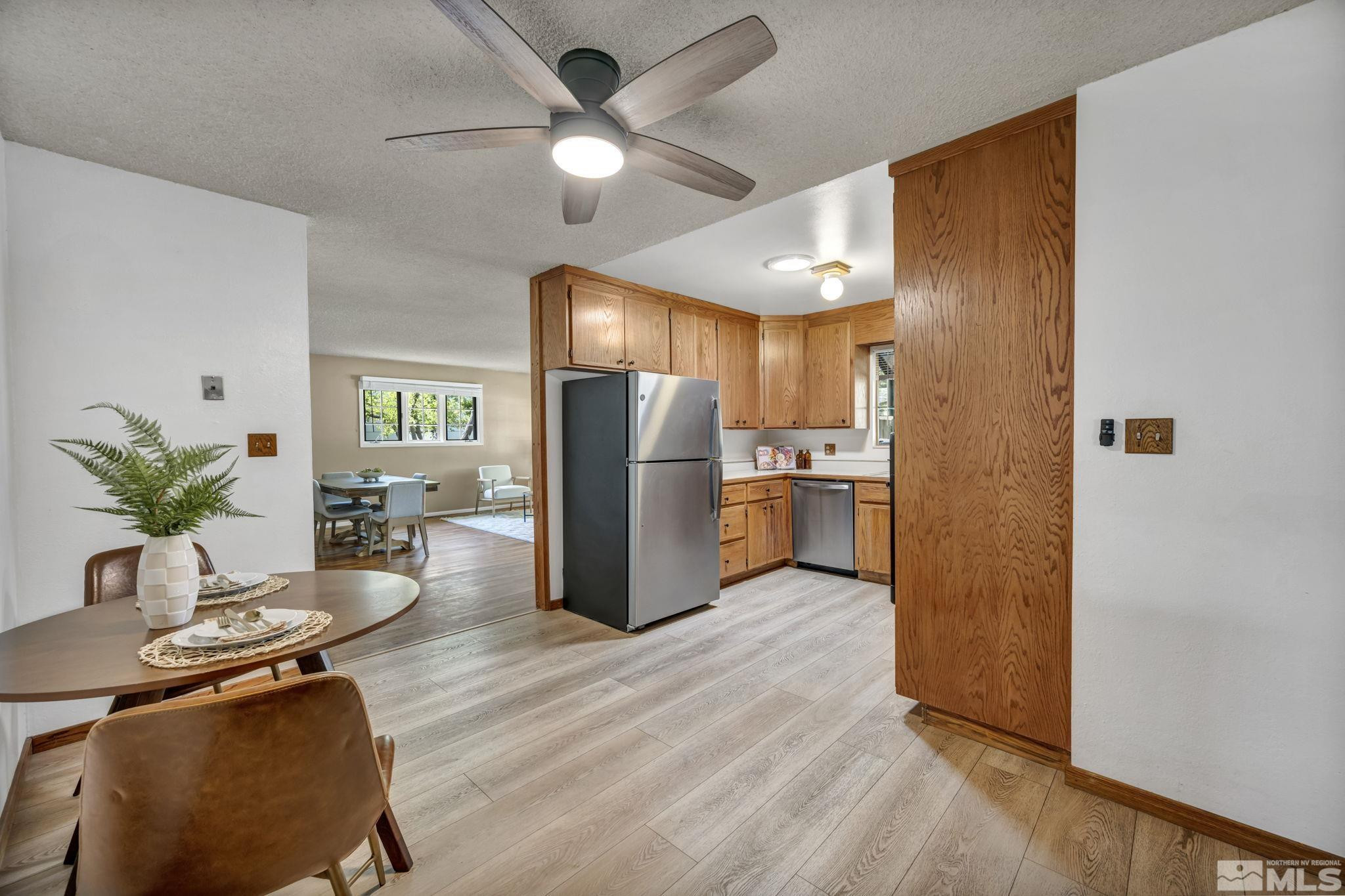 909 Norrie Drive Carson City, NV 89703 - Photo 10 of 39 a view of kitchen with stainless steel appliances granite countertop cabinets and wooden floor