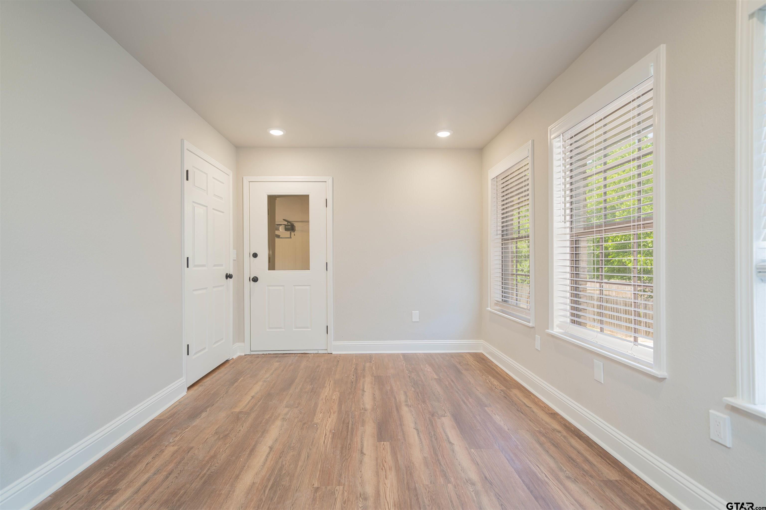 291 Taylor George Road Longview, TX 75605 - Photo 21 of 35 a view of a room with wooden floor and windows