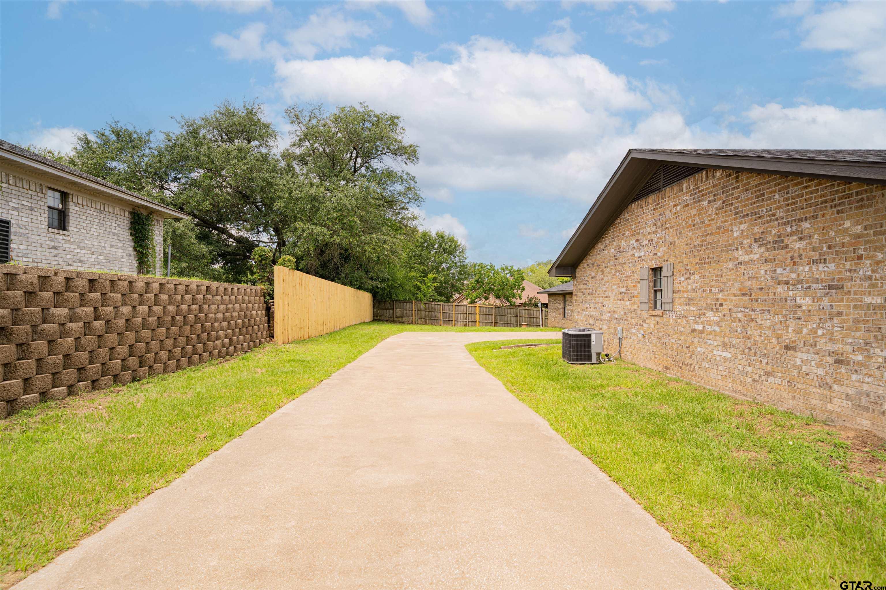 291 Taylor George Road Longview, TX 75605 - Photo 26 of 35 a view of swimming pool with a yard