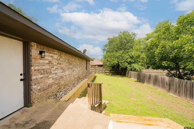 an aerial view of residential houses with outdoor space and swimming pool