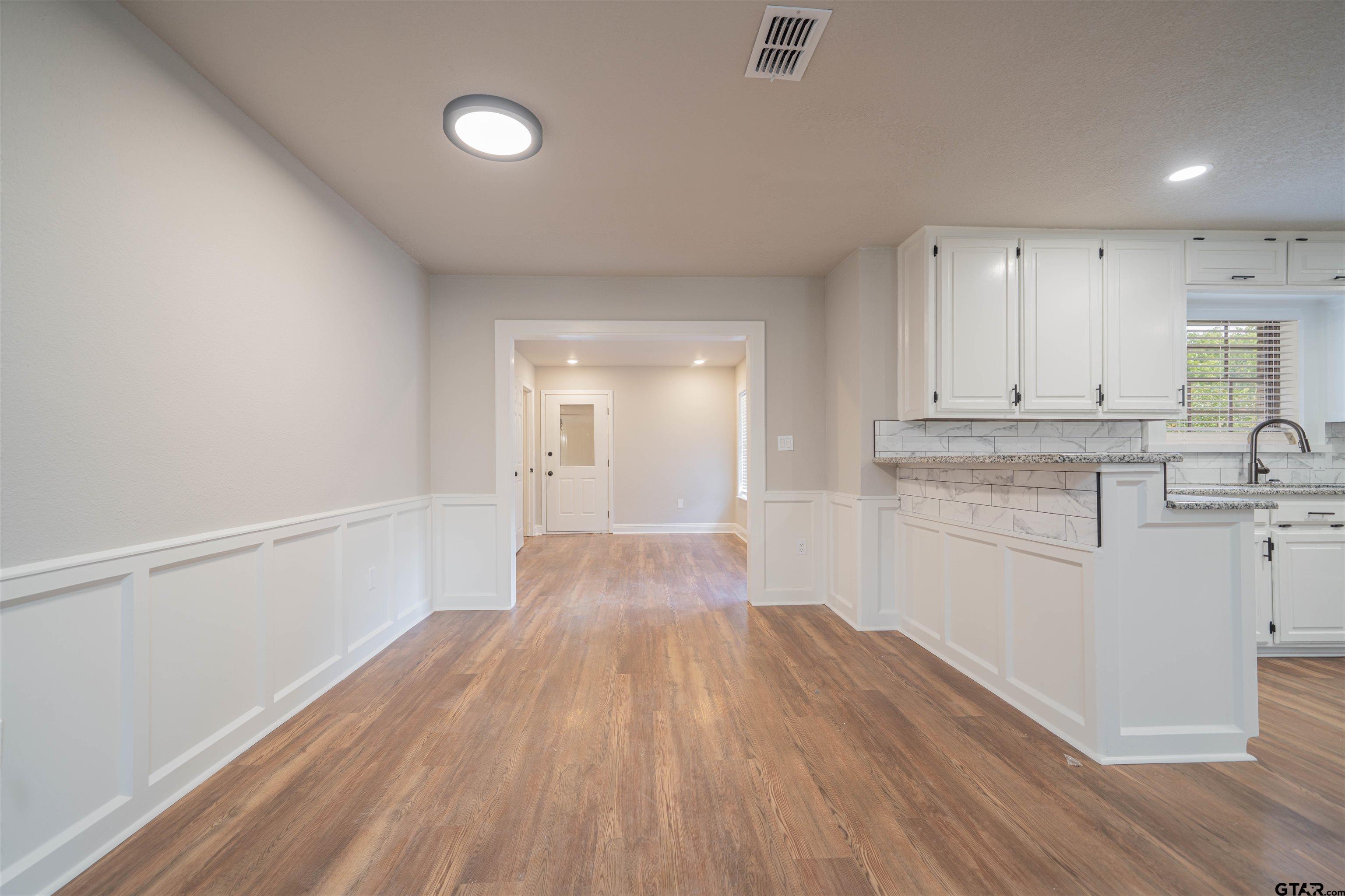 291 Taylor George Road Longview, TX 75605 - Photo 8 of 35 a view of a kitchen with wooden floor