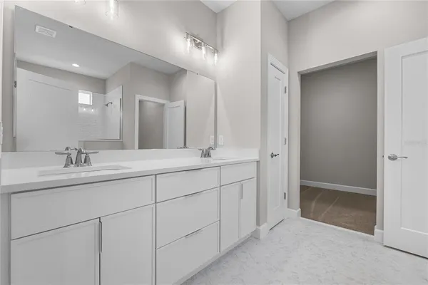 an empty room with a ceiling fan and a window