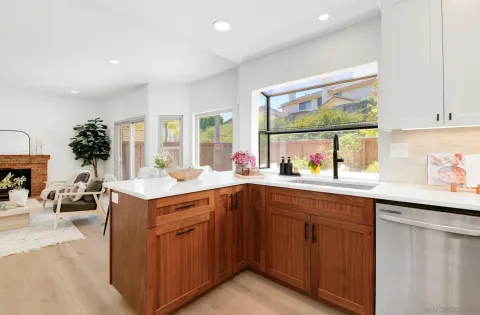 a kitchen with a sink and cabinets