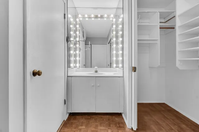 a view of a bathroom from a hallway