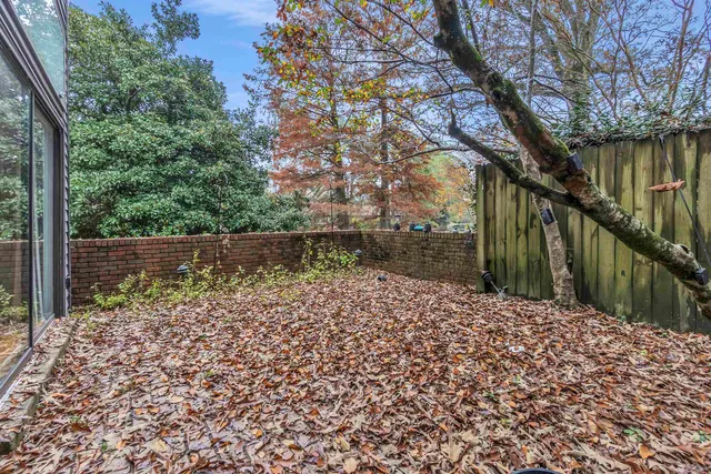 a backyard of a house with lots of green space