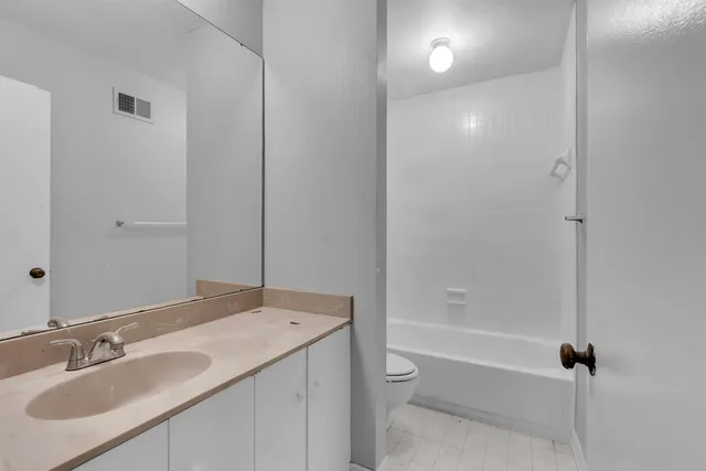 a bathroom with a sink and a toilet