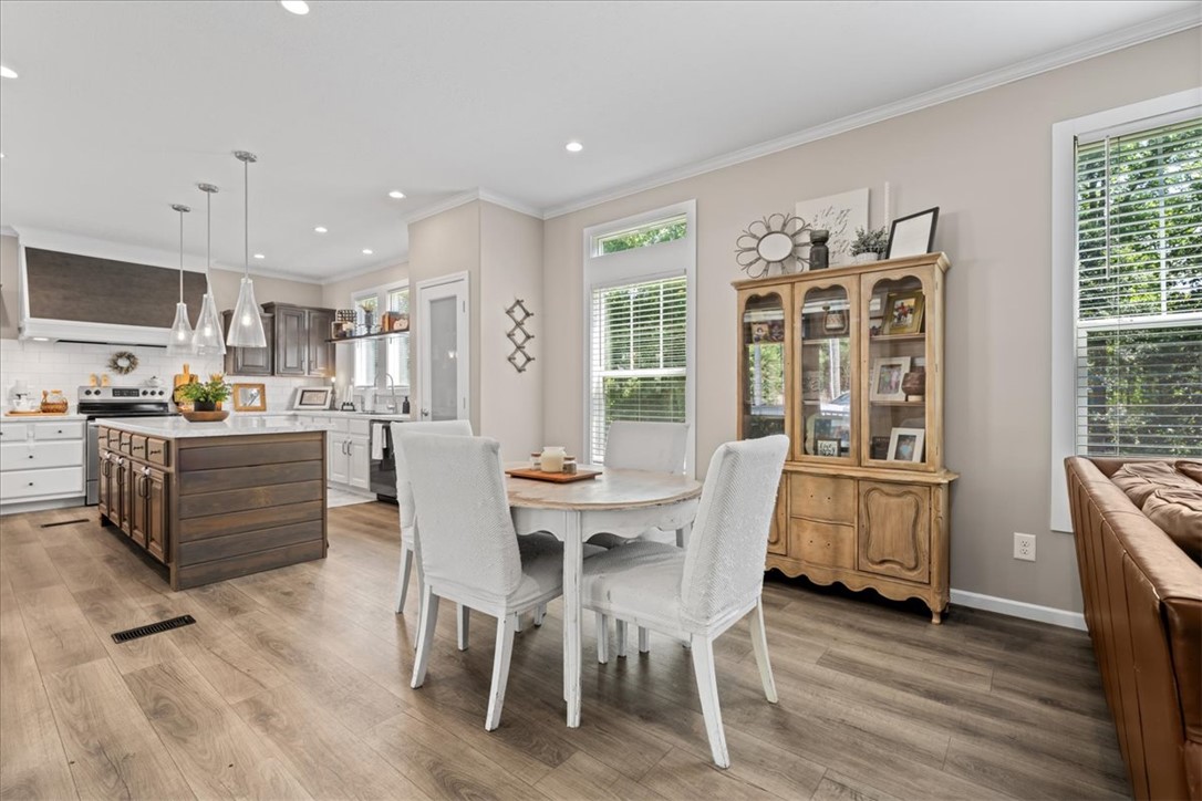 116 Parkview Road Iva, SC 29655 - Photo 12 of 44 An inviting eat-in kitchen with a spacious island, pendant lighting, and warm wood flooring.