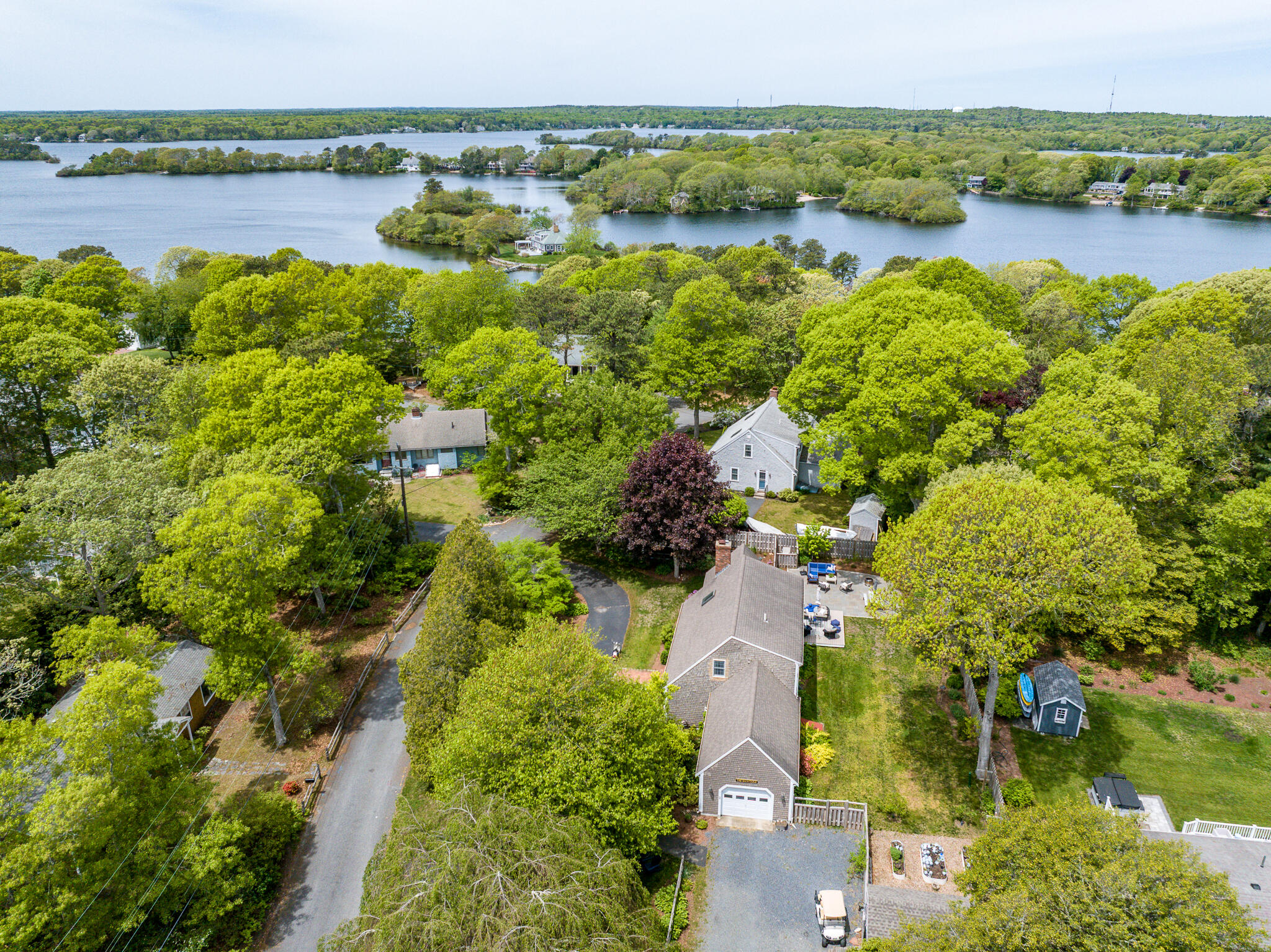61 Angus Way Centerville, MA 02632 - Photo 57 of 59 a view of a lake with houses in the back
