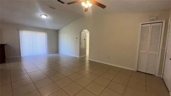 an empty room with fan