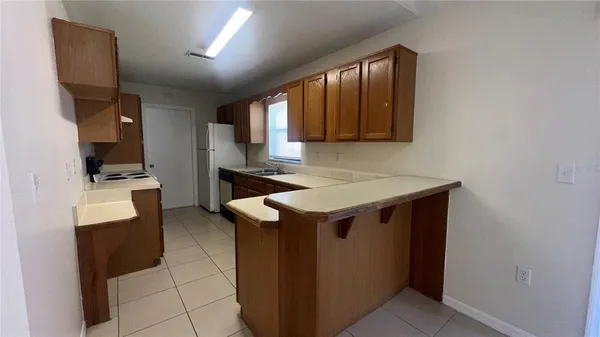 a utility room with sink dryer and washer