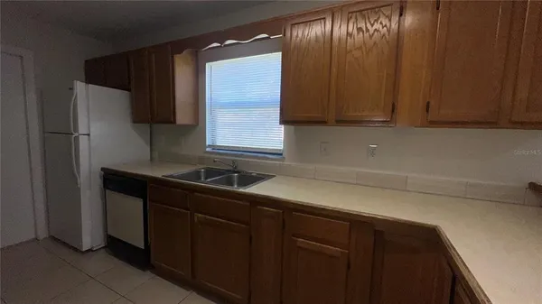 a kitchen with a sink and cabinets