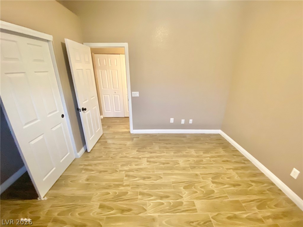 2000 Turquoise Ridge Street, Unit 204 Las Vegas, NV 89117 - Photo 21 of 29 Natural wood-look tile flooring flows throughout this adaptable living space.