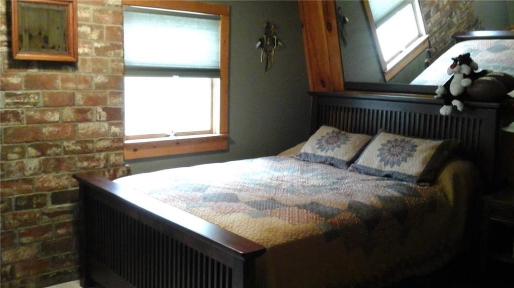 1051 Thompson Run Road Harwick, PA 15049 - Photo 13 of 19 2nd bedroom with brick and pine walls