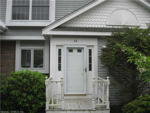 14 Larkspur Farm Road, Unit 14 Torrington, CT 06790 - Photo 1 of 1 a front view of a house with a garden