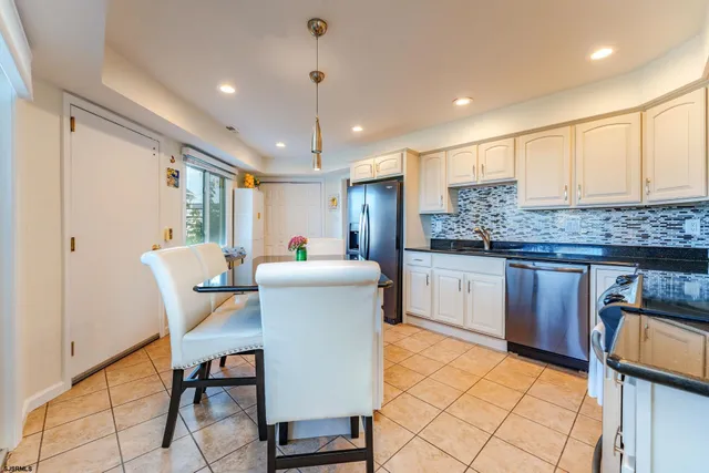 a view of a livingroom with furniture and a flat screen tv
