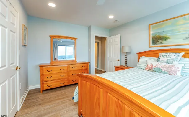 a view of walk in closet with clothes