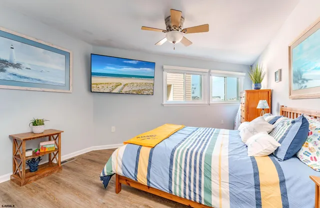 a view of a terrace with couches and lounge chairs
