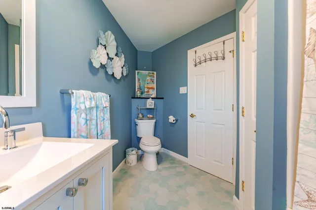 a view of a balcony with chairs and wooden floor