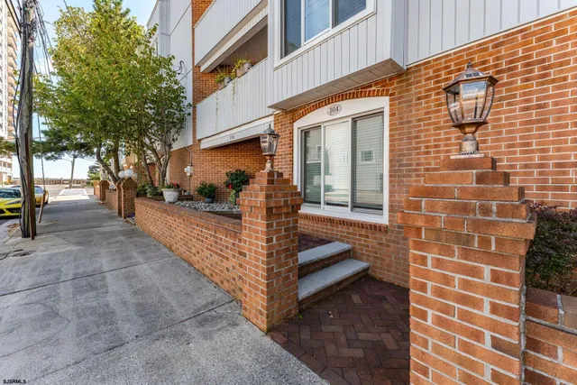 a front view of a house with stairs