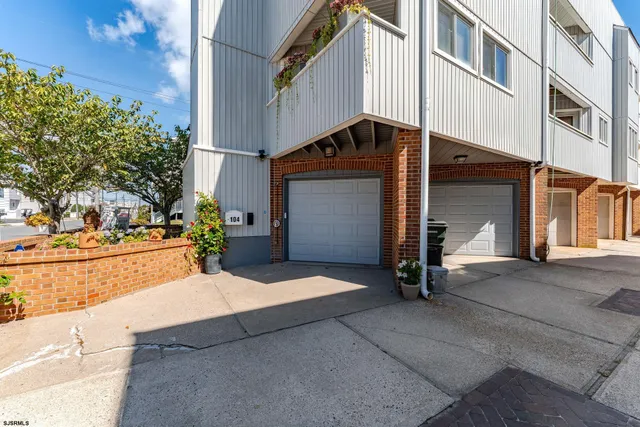 a view of a balcony with furniture and wooden floor