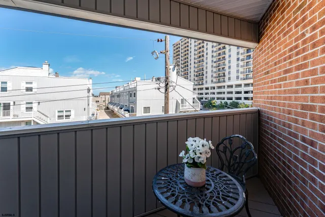 a view of building with an outdoor space and seating