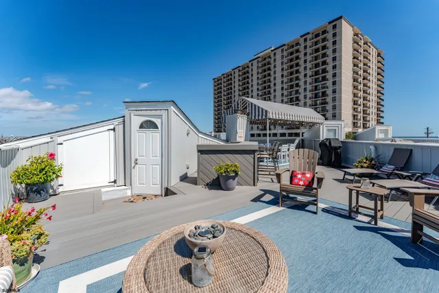 a view of a balcony with chairs